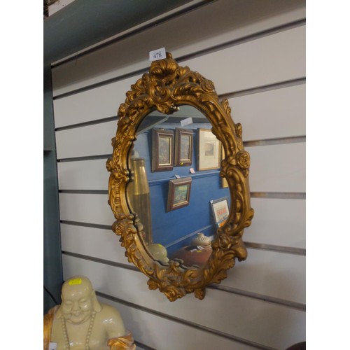 478 - Gilt framed ornate oval mirror W38 H56cm