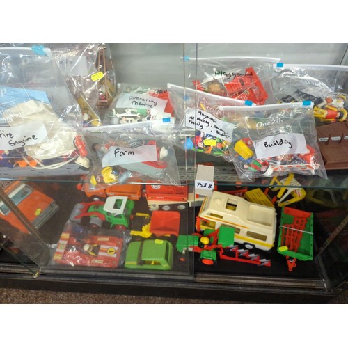 758B - Playmobile bundle over 2 shelves including figures, vehicles and accessories.