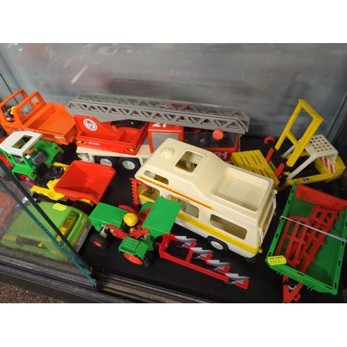 758B - Playmobile bundle over 2 shelves including figures, vehicles and accessories.