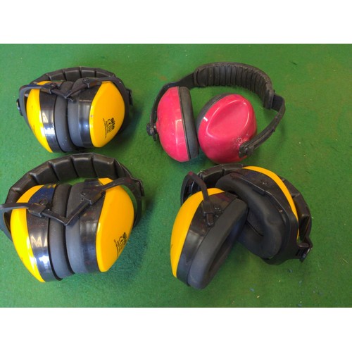 297 - Four pair of ear defenders, some unused.