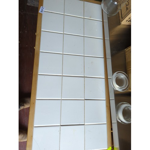 214A - Tile topped wheeled kitchen unit. W80cm D37cm H84cm