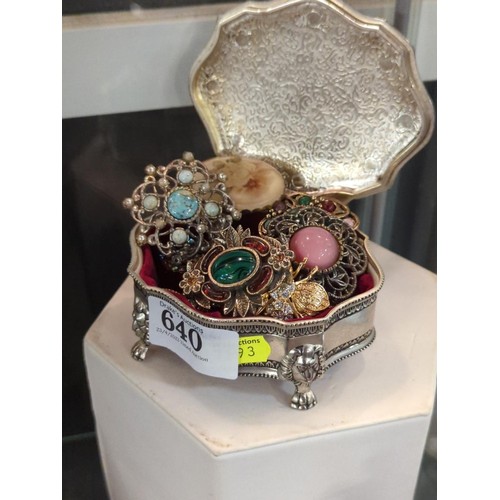 640 - Plated box with costume jewellery, mostly brooches