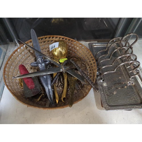 664 - Mixed collectables, including nut crackers, letter openers, plated toast rack and other items