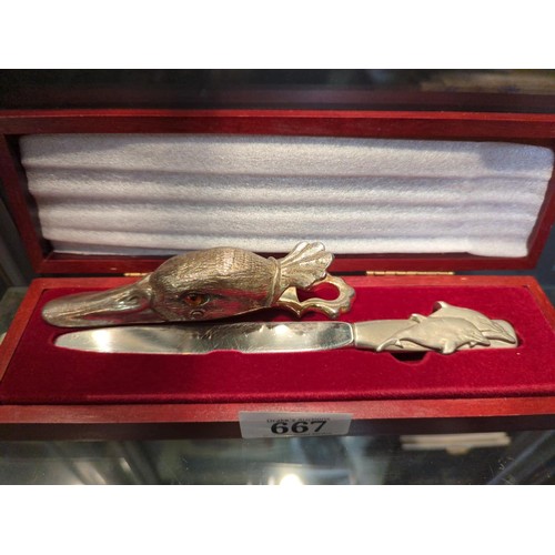 667 - Silver plated duck head paper clip and a boxed Royal Selangor pewter letter opener with dolphins to ... 