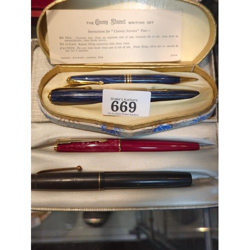 669 - Boxed Conway Stewart writing set, comprising blue streaked no 36 fountain pen with 14ct gold nib and... 