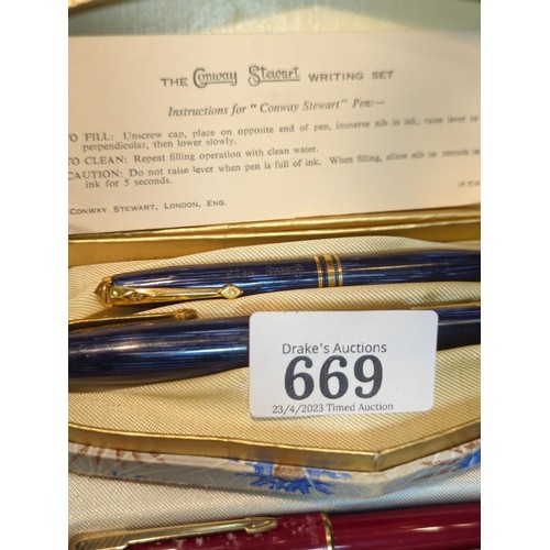 669 - Boxed Conway Stewart writing set, comprising blue streaked no 36 fountain pen with 14ct gold nib and... 