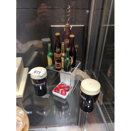 671 - Guinness collectables, including pair of salt and pepper shakers, button set, bottle opener, miniatu... 