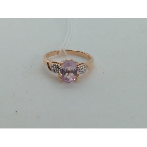 656 - 18ct rose gold, kunzite and diamond ring, size O, gross weight 4.35 grams