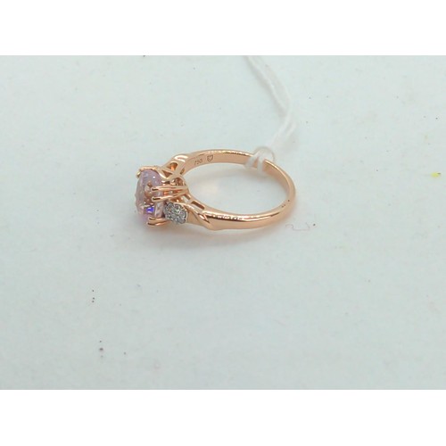 656 - 18ct rose gold, kunzite and diamond ring, size O, gross weight 4.35 grams