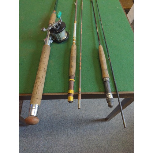 276 - Three fishing rods and one reel