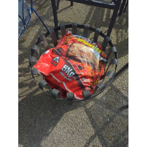 107 - Metal fire basket with bag of fire briquettes