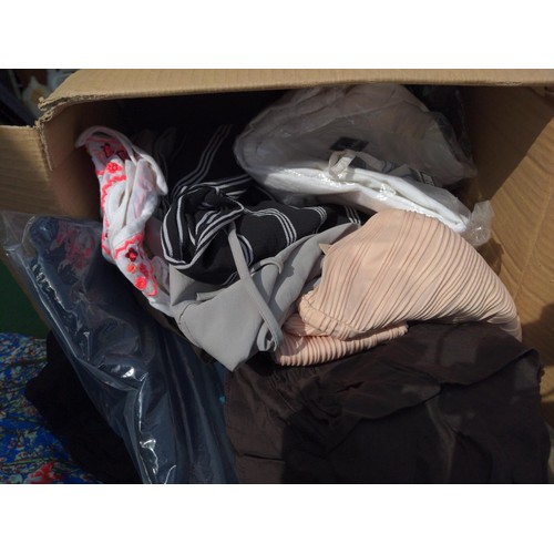 169 - Two boxes of mixed ladies clothes, some sized 20, 12, appear new.