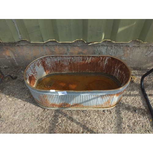 22 - Ribbed tin trough. W53cm H18cm