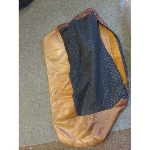 302 - Bag of leather large seat covers and other cuts of leather.