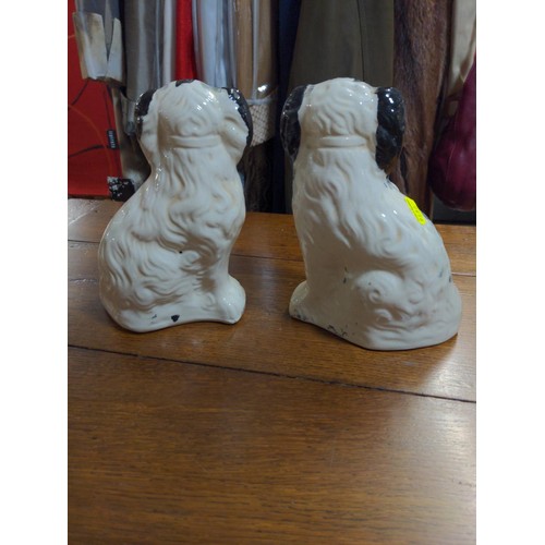 493 - Pair of Staffordshire spaniels, H21cm