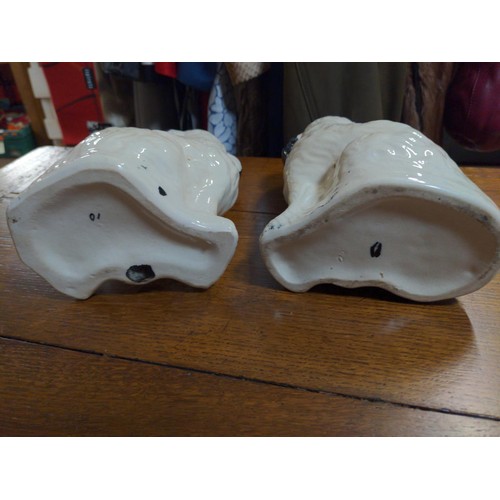 493 - Pair of Staffordshire spaniels, H21cm