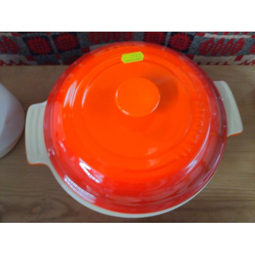 519 - Seven pieces of orange Le Creuset ceramic cookware