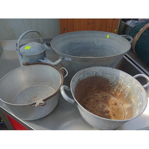 55 - Galvanised lot, includes watering can, 2 tubs together with preserve pan. Largest tub W64cm