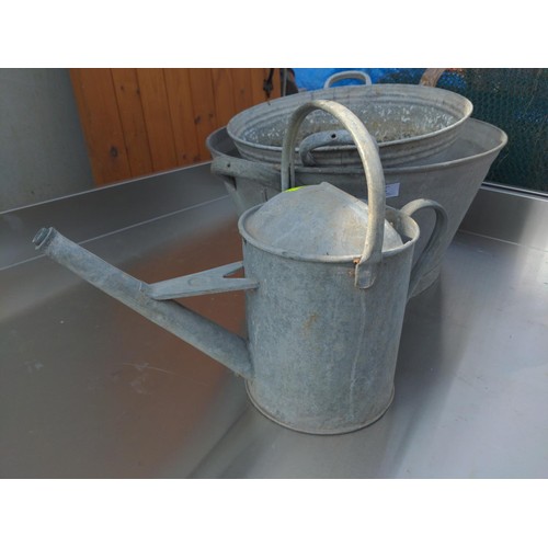 55 - Galvanised lot, includes watering can, 2 tubs together with preserve pan. Largest tub W64cm