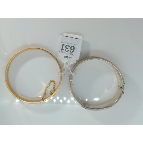 631 - HM silver cuff bracelet and a rolled cuff gold bracelet