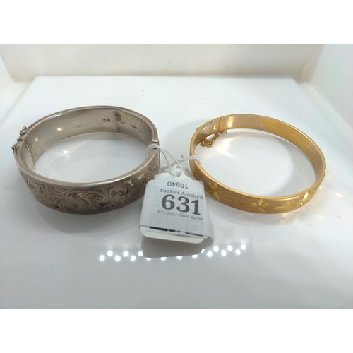 631 - HM silver cuff bracelet and a rolled cuff gold bracelet