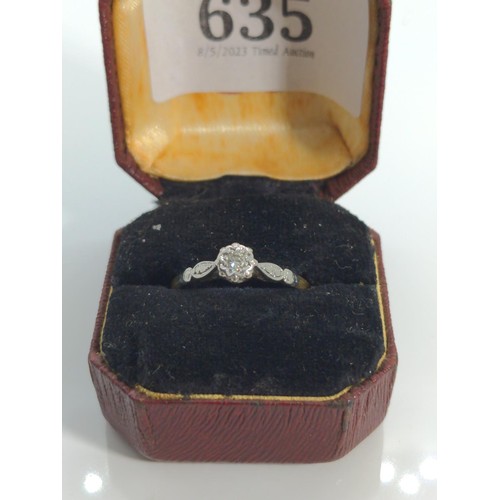 635 - Yellow metal and diamond solitaire ring, testing positive for 18ct gold, with white metal mount and ... 