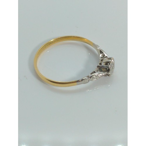 635 - Yellow metal and diamond solitaire ring, testing positive for 18ct gold, with white metal mount and ... 