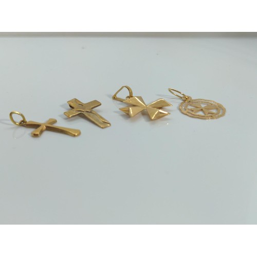 644 - Four 9ct gold cross pendants, gross weight 2.95 grams