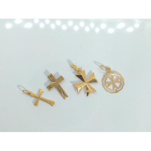 644 - Four 9ct gold cross pendants, gross weight 2.95 grams