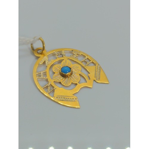 645 - 9ct gold horse shoe pendant 'NAZHEH', set with turquoise, gross weight 1.15 grams