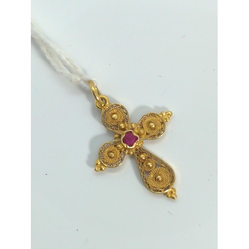 646 - 18ct gold filigree cross pendant set with a small ruby, gross weight 2 grams