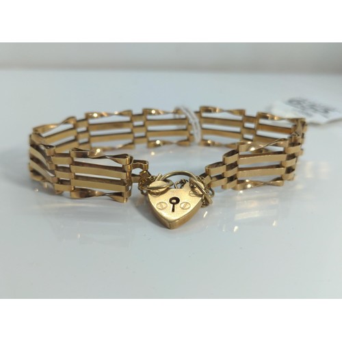 655 - 9ct gold gate link bracelet with a heart-shaped padlock clasp, 9.2 grams