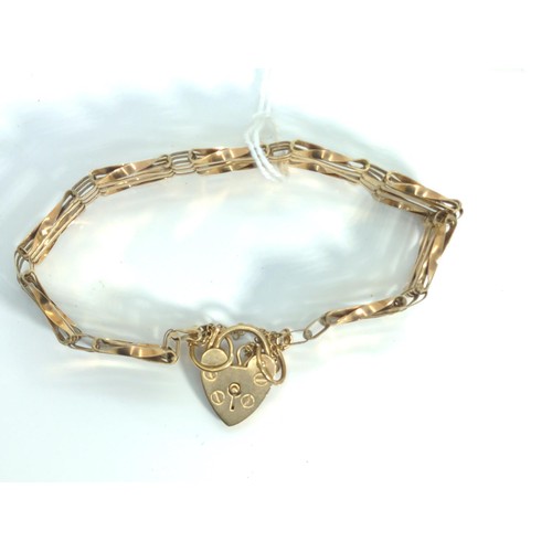 655 - 9ct gold gate link bracelet with a heart-shaped padlock clasp, 9.2 grams