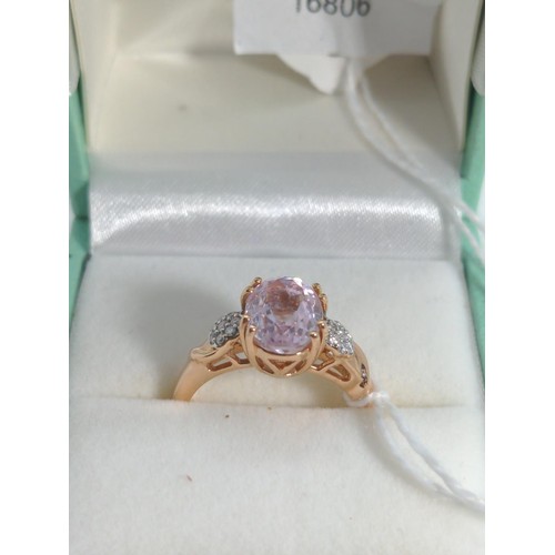 656 - 18ct rose gold, kunzite and diamond ring, size O, gross weight 4.35 grams