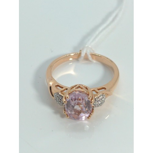 656 - 18ct rose gold, kunzite and diamond ring, size O, gross weight 4.35 grams