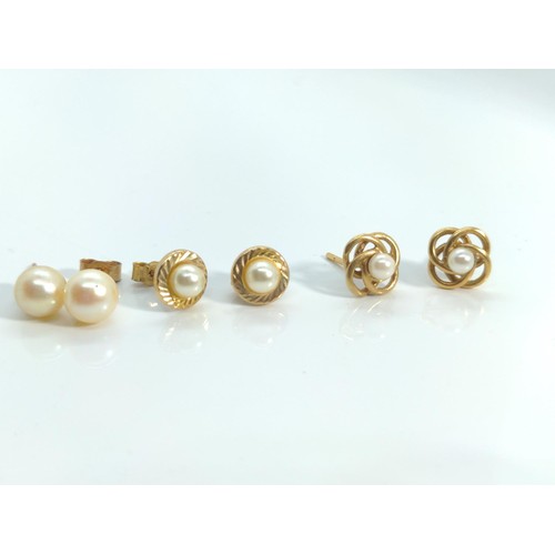 660 - Three pairs of cultured pearl ear studs, two set with 9ct gold and one with yellow metal testing pos... 