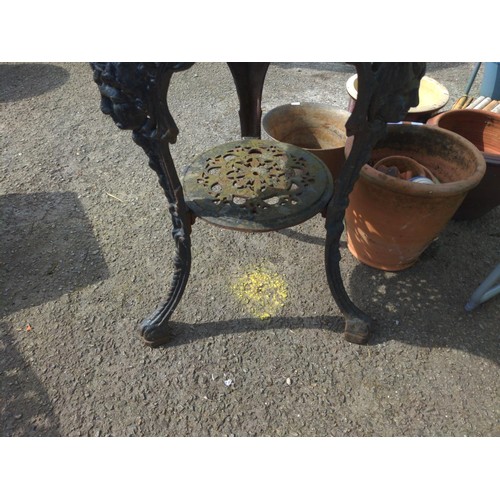 98 - Cast iron bistro table base with slate top. D75cm