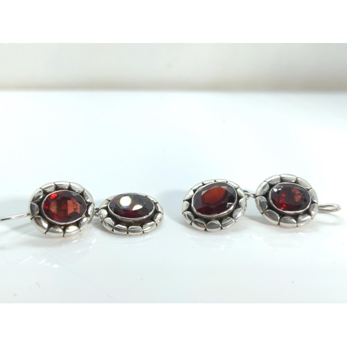 666 - Pair of 925 silver and garnet pendant earrings, length 39mm, gross weight 8.07 grams