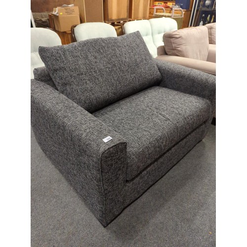 986 - Large snuggle chair/single sofa bed in charcoal tweed style upholstery. W125 D95 H70 (Measurements a... 