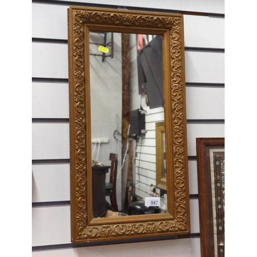 987 - Rectangle mirror in ornate carved mirror.  h 56 w 29 cm