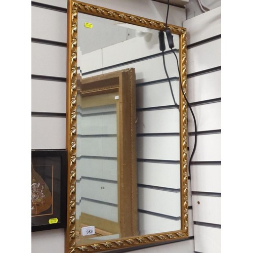 988 - Rectangle bevelled ornately framed mirror  h70 w45 cm