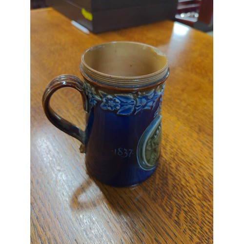 557 - Commemorative mug by Doulton Victoria 1837 to 1897