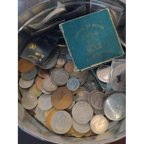 597 - Tin of British and world coins, gross weight including tin 2.09kg