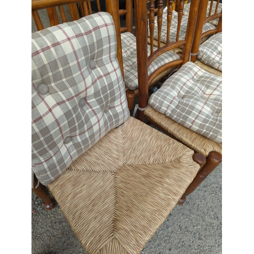 377 - Set of 8 rush seated ash chairs based on an 18th century design , with tie-on Walton cushions