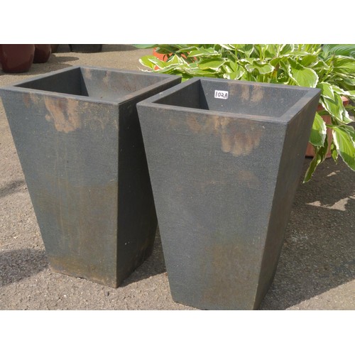 102A - Pair of square tapered fibreglass planters. H55cm W35cm