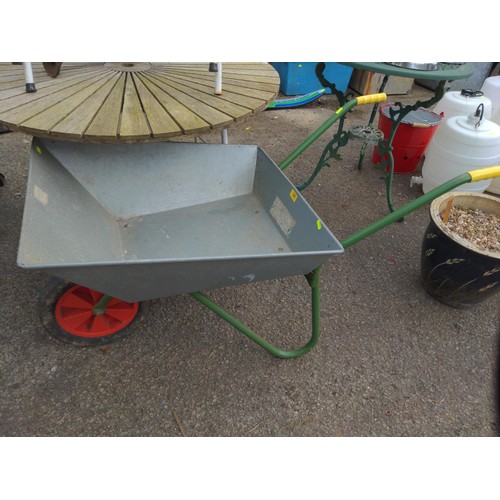 116 - Small metal wheel barrow with solid wheel