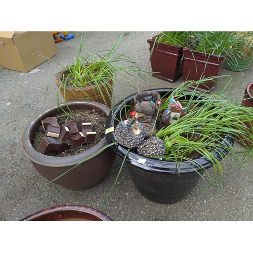 127 - 3 planters with bulb contents, includes plant feet & hedgehog ornaments. Tallest planter H38cm