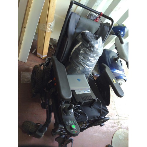 141 - Invacare Bora/Spectra XTR Series power wheelchair. With charger, cover and handbook.