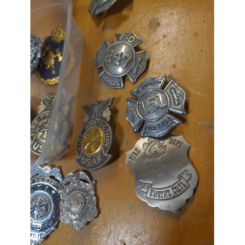 576 - Large collection of US Fire Department badges