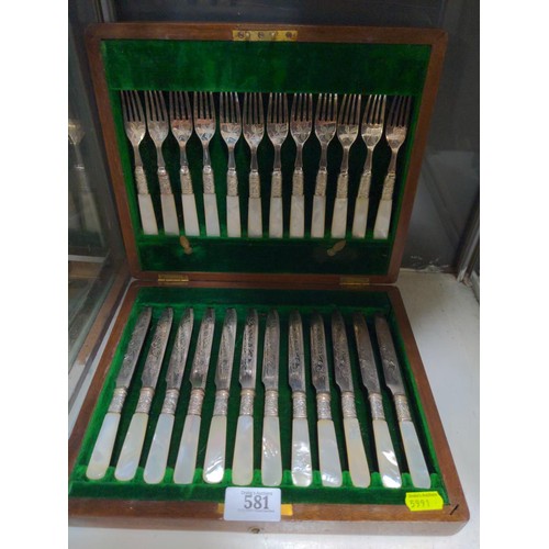 581 - Boxed set of twelve mother-of-pearl handled silver plated dessert forks and knives, together with si... 